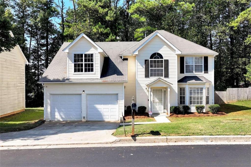 2325 Rambling Way Lithonia, GA 30058 - Photo 1 of 1 a front view of a house with a yard