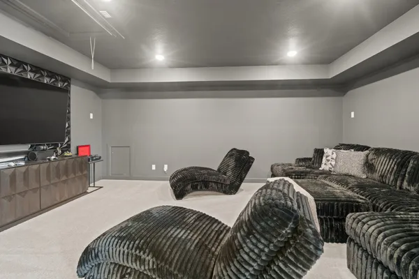 a bedroom with two beds and a flat screen tv