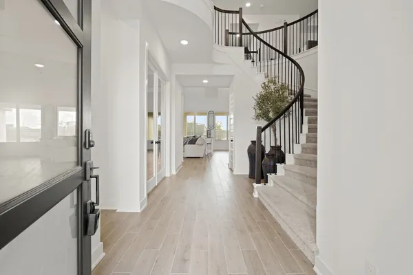 a view of a hallway view with staircase