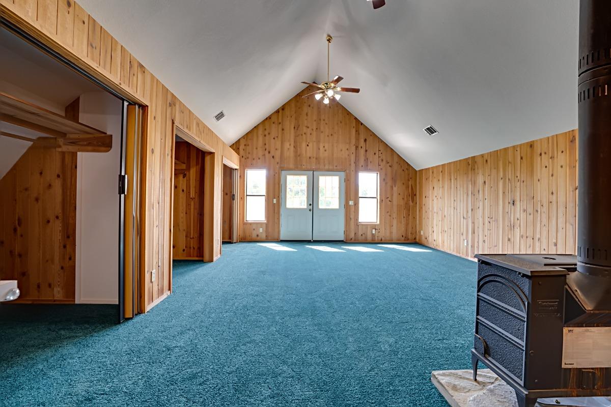 184 Carmel Road Burson, CA 95225 - Photo 14 of 39 a bed room with a bed and a television