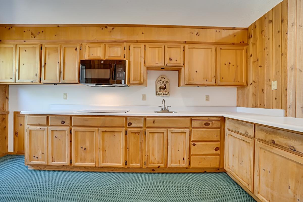 184 Carmel Road Burson, CA 95225 - Photo 16 of 39 a kitchen with stainless steel appliances granite countertop a sink a stove and white cabinets
