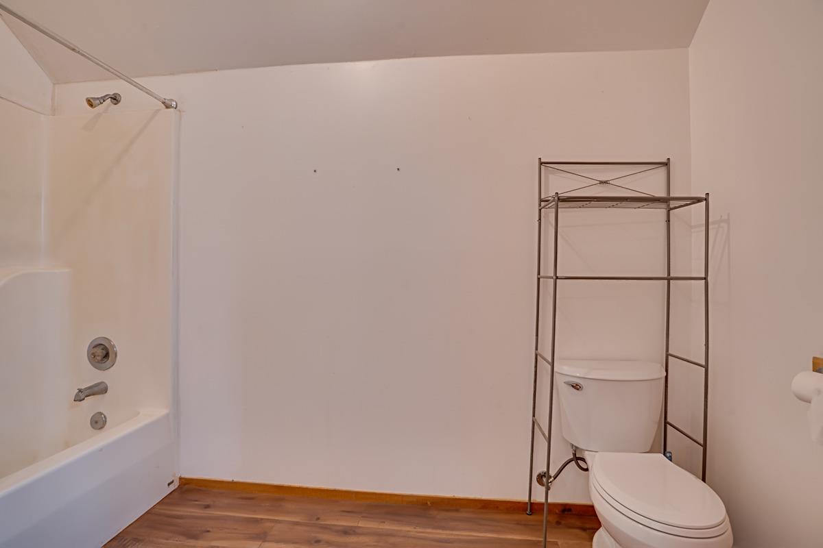 184 Carmel Road Burson, CA 95225 - Photo 18 of 39 a bathroom with a toilet and a shower