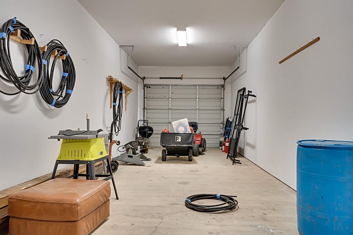 184 Carmel Road Burson, CA 95225 - Photo 5 of 39 a room with gym equipment and a mirror