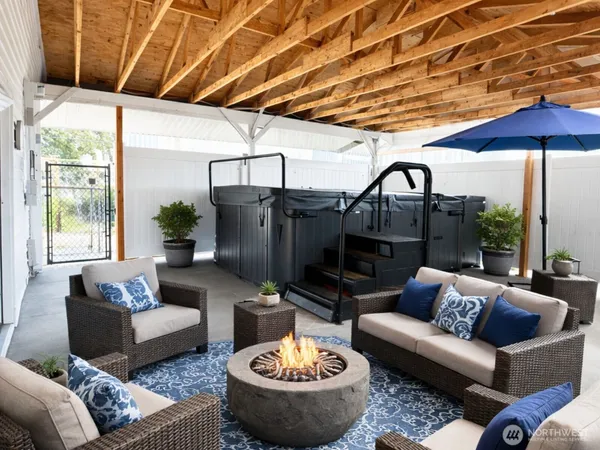 a living room with furniture a fireplace and a table