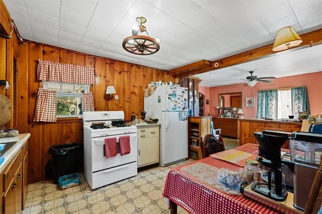 a view of a livingroom with furniture and a window