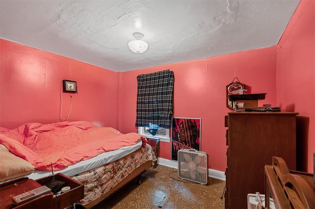 1182 Airport Road Aliquippa, PA 15001 - Photo 23 of 25 a bed room with a bed and a television