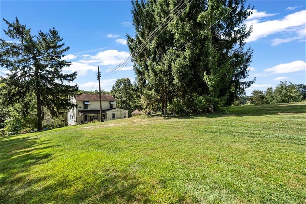 1182 Airport Road Aliquippa, PA 15001 - Photo 4 of 25 a swimming pool with wooden fence