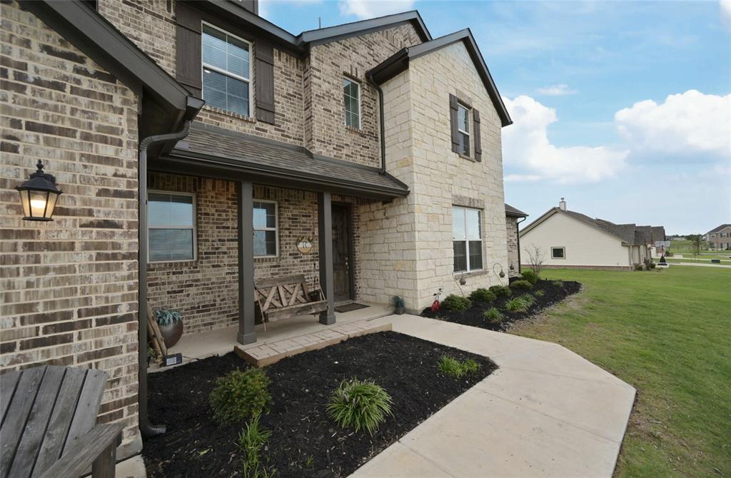 116 Spanish Moss Trail Rhome, TX 76078 - Photo 3 of 40 Covered front sitting porch