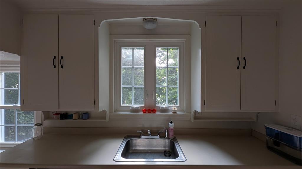 1885 Graham Boulevard Pittsburgh, PA 15235 - Photo 11 of 31 a bathroom with a sink a bathtub and a window