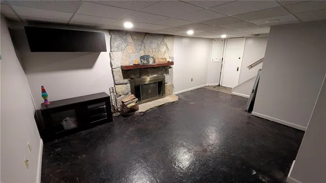 a view of a livingroom with furniture and a fireplace
