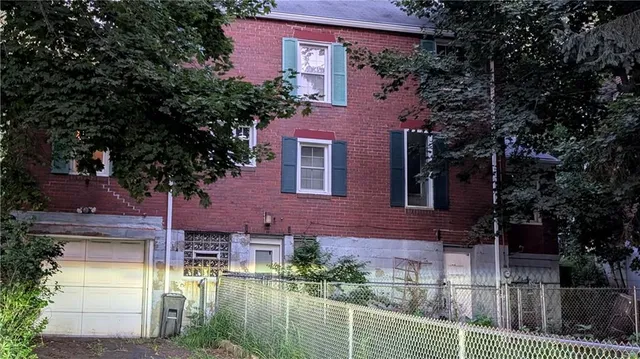 front view of a house with a small yard