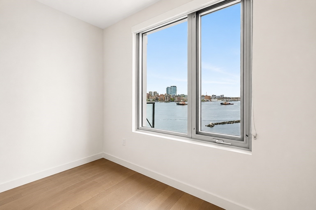 45 Lewis Street, Unit 312 Boston, MA 02128 - Photo 7 of 17 an empty room with a window