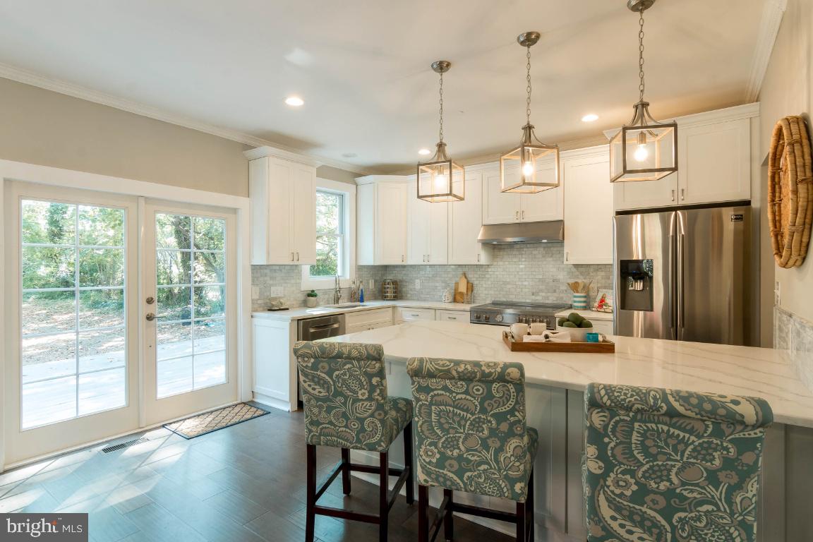833 Bay Ridge Avenue Annapolis, MD 21403 - Photo 10 of 43 Kitchen with French Doors to Back Deck & Yard