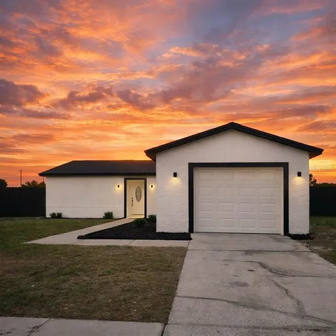 a house view with a backyard space