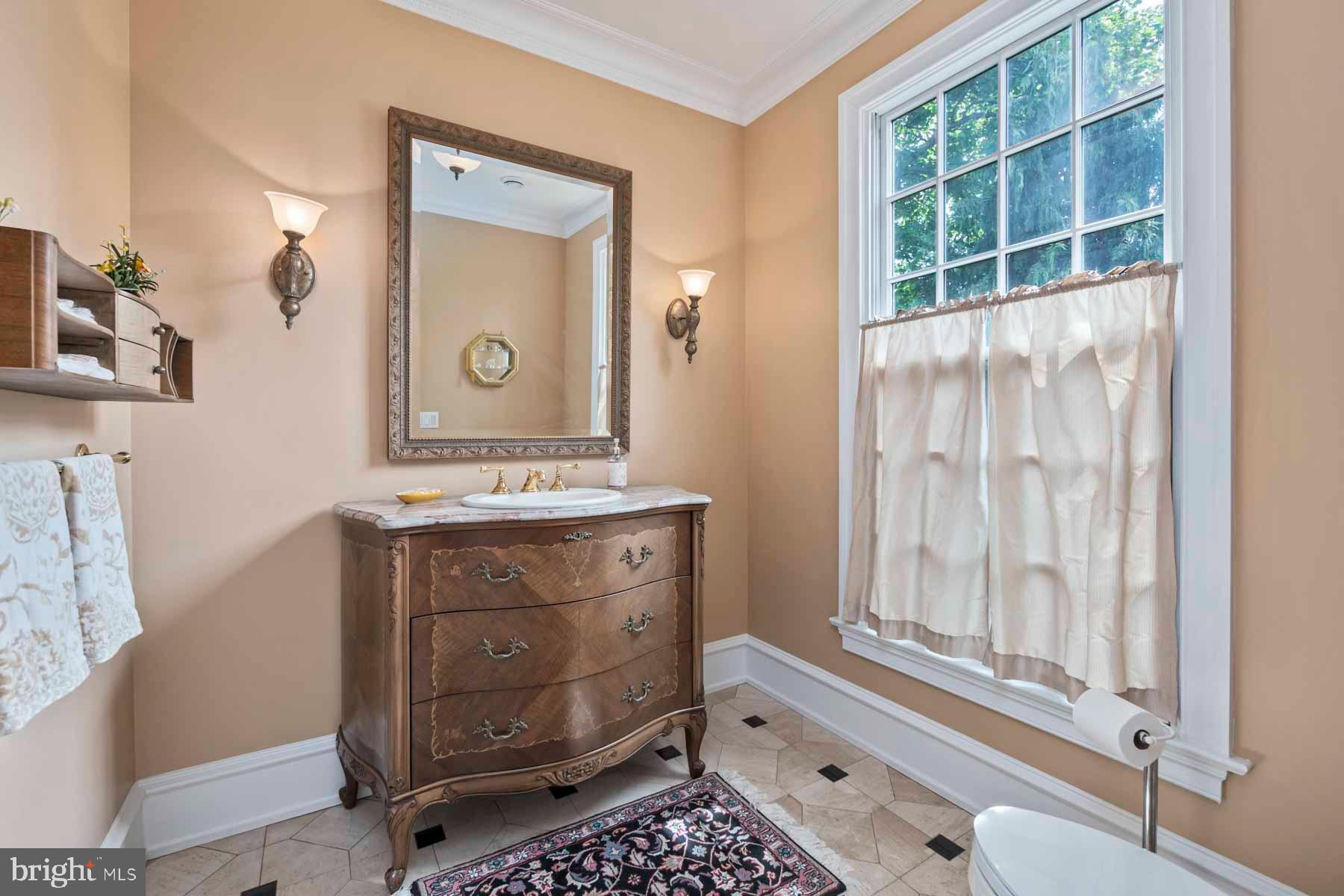 2 Matlack Lane Villanova, PA 19085 - Photo 25 of 83 a bathroom with a sink a mirror and a window