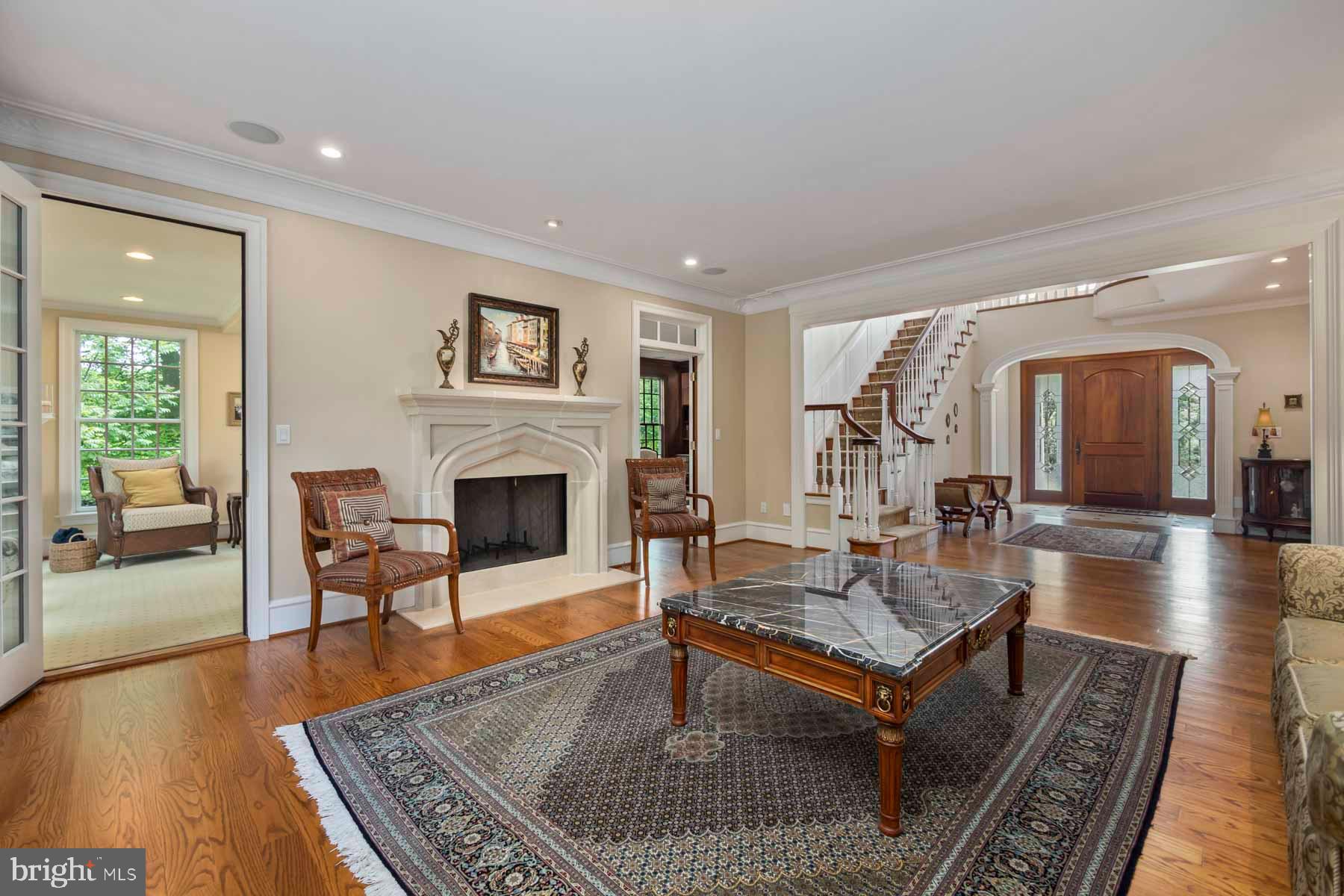 2 Matlack Lane Villanova, PA 19085 - Photo 27 of 83 a living room with furniture a rug wooden floor and a fireplace