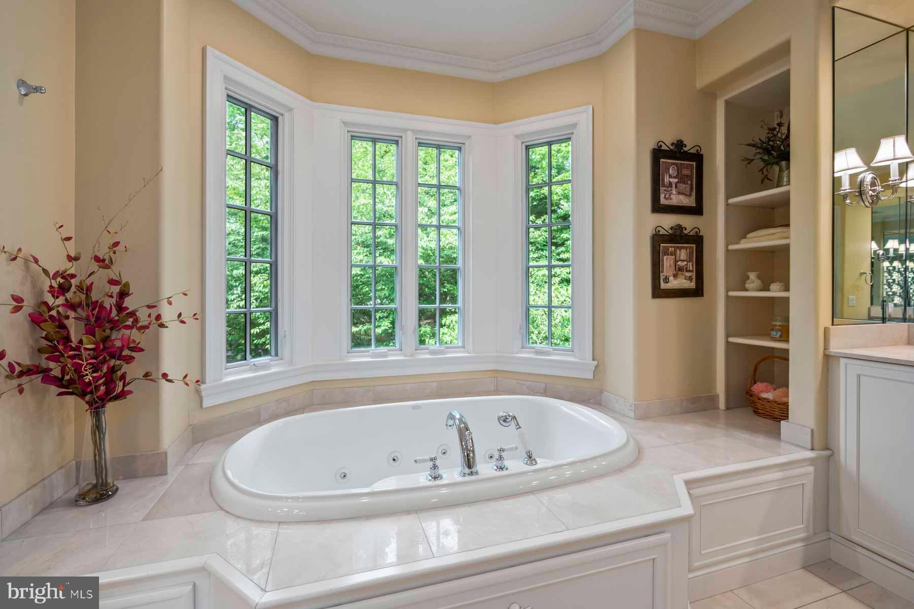 2 Matlack Lane Villanova, PA 19085 - Photo 66 of 83 a bath tub sitting in a bathroom next to a window