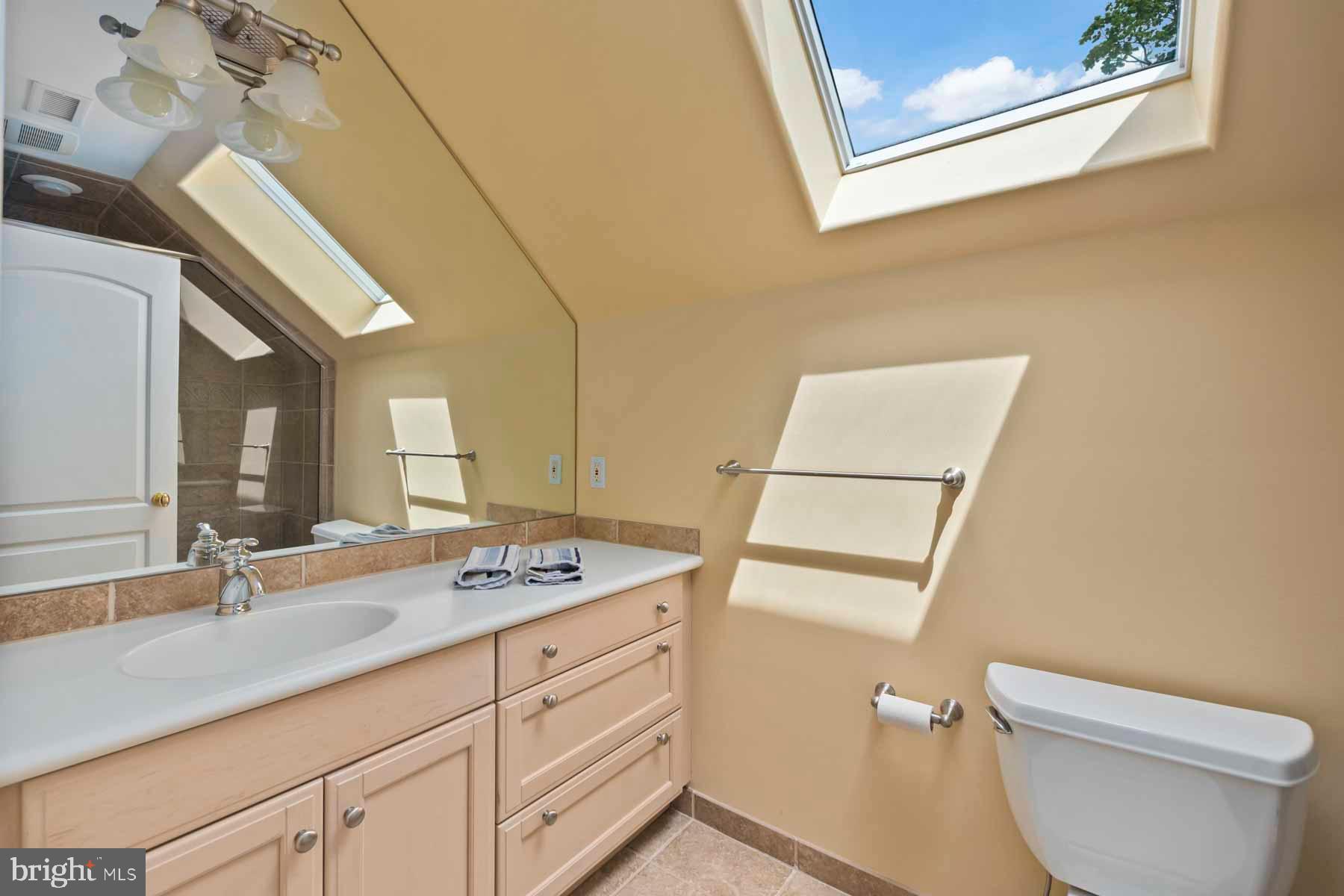 2 Matlack Lane Villanova, PA 19085 - Photo 83 of 83 a bathroom with a granite countertop sink mirror vanity and toilet