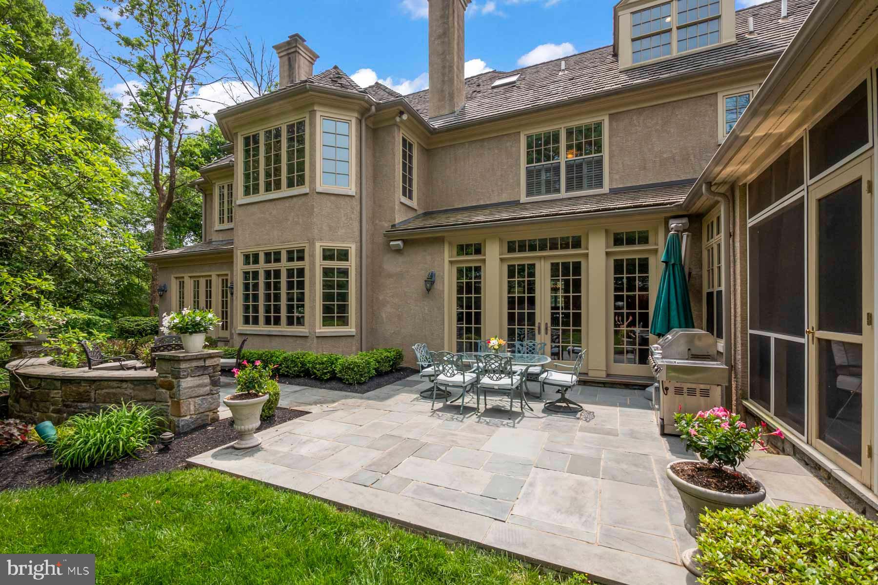 2 Matlack Lane Villanova, PA 19085 - Photo 9 of 83 a front view of a house with garden and porch