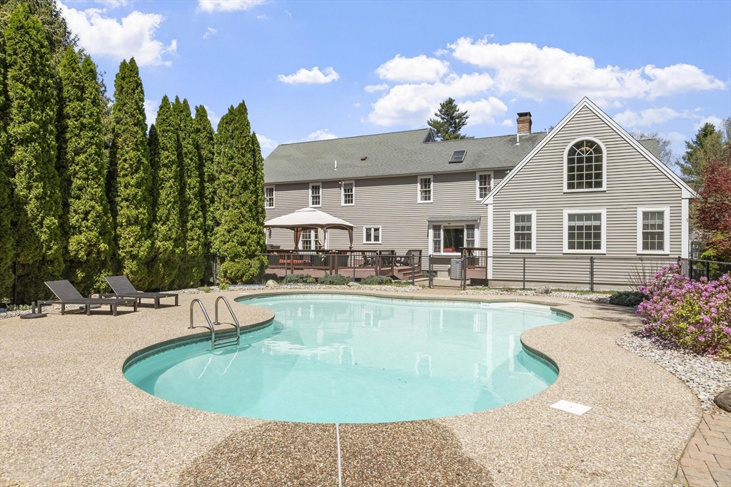 4 Ridge Road Pepperell, MA 01463 - Photo 6 of 42 a view of a house with swimming pool