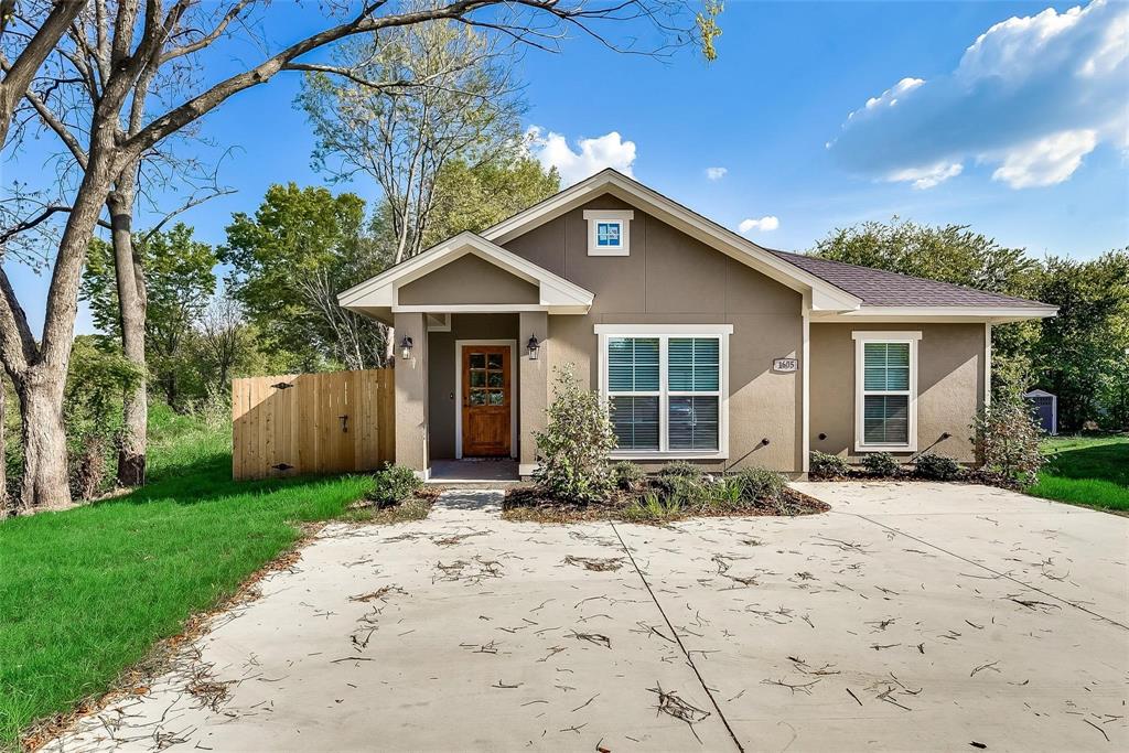 1605 West 13th Avenue Corsicana, TX 75110 - Photo 1 of 19 a front view of a house with a yard and porch