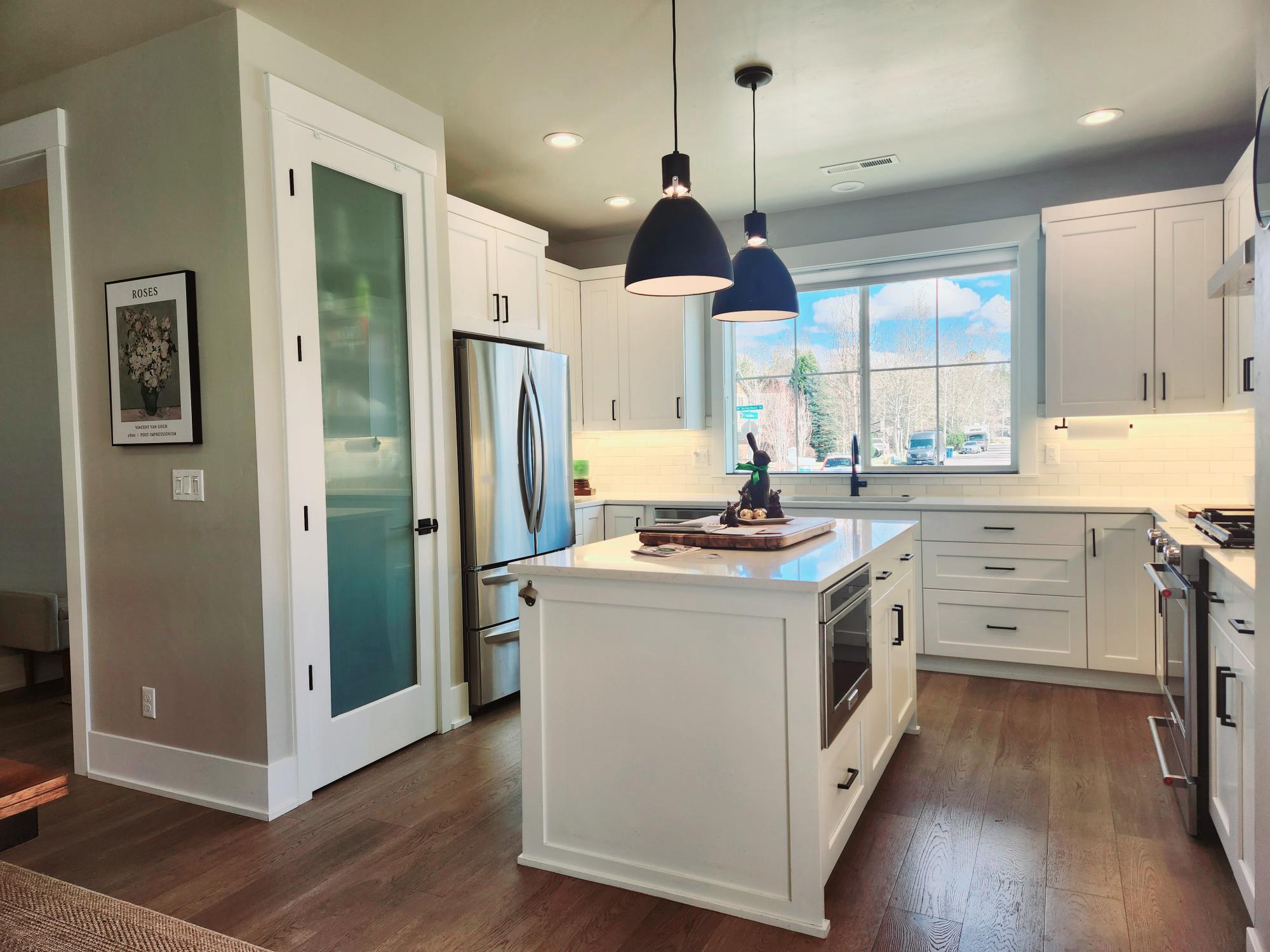 2345 Northwest Skyline Ranch Road Bend, OR 97703 - Photo 8 of 20 Kitchen has large pantry, island has more cabinets and microwave.