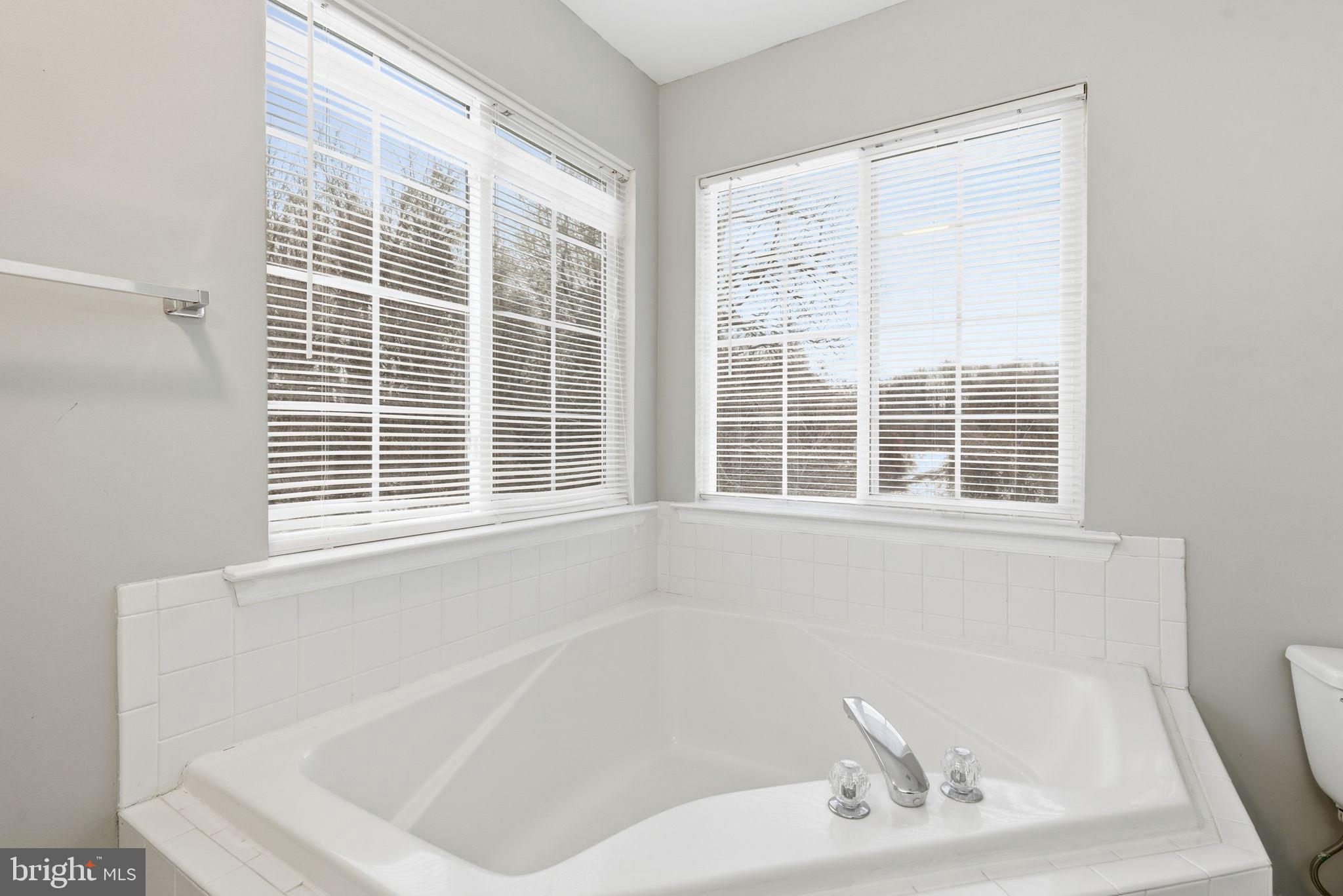 907 Vauxhall Road Landover, MD 20785 - Photo 15 of 37 a white bath tub sitting next to a window