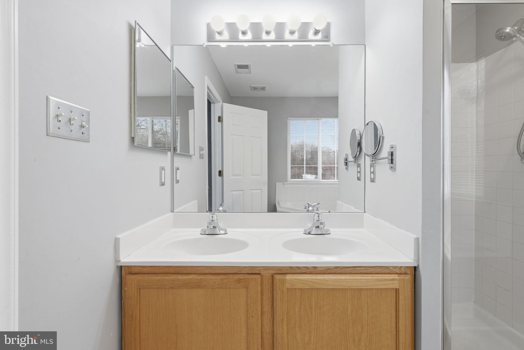 907 Vauxhall Road Landover, MD 20785 - Photo 18 of 37 a bathroom with a sink and a mirror
