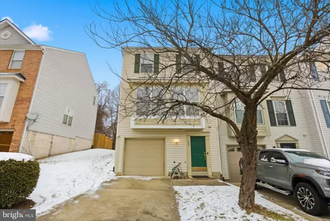 a view of a car park in front of house