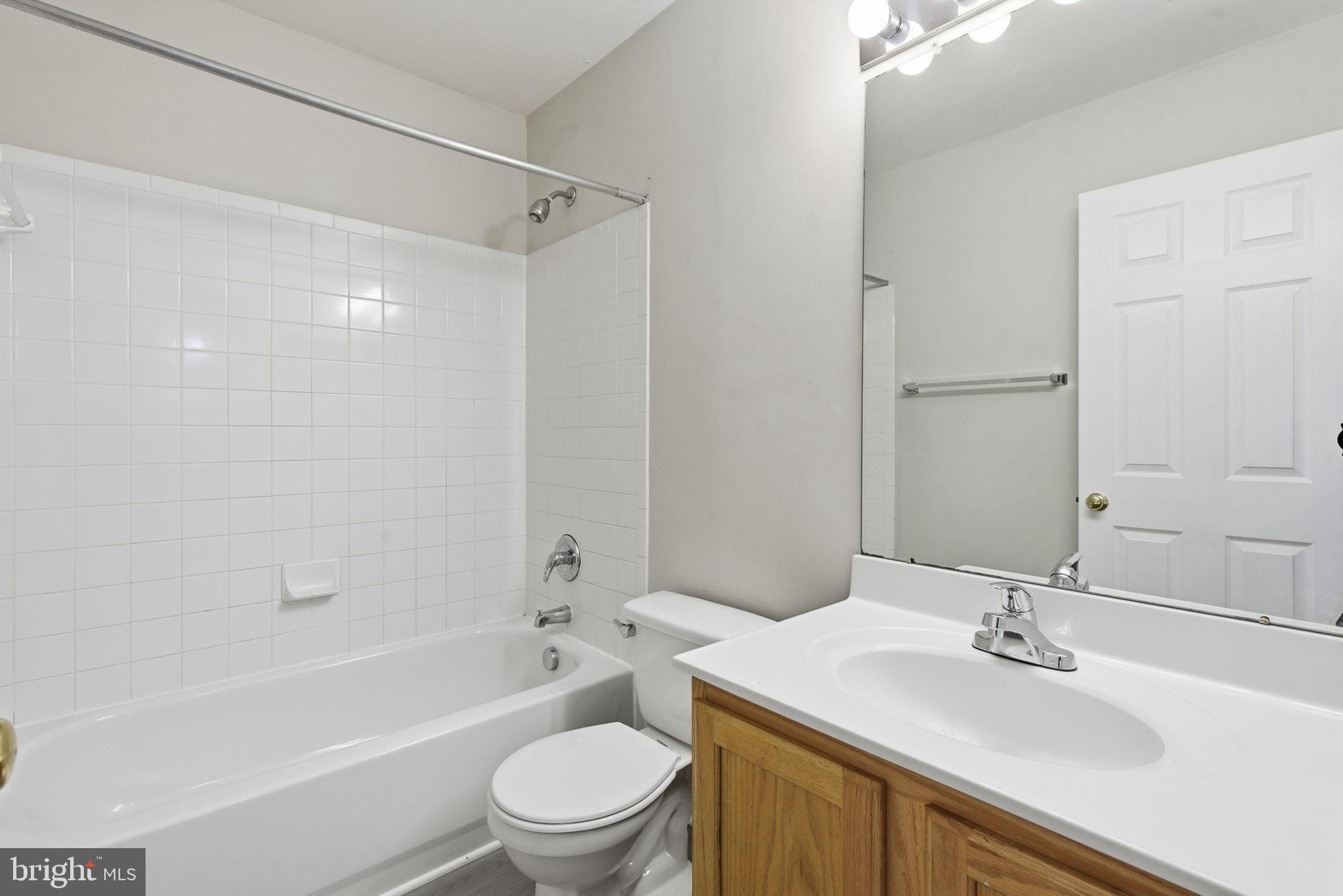 907 Vauxhall Road Landover, MD 20785 - Photo 24 of 37 a bathroom with a sink a toilet and a bathtub