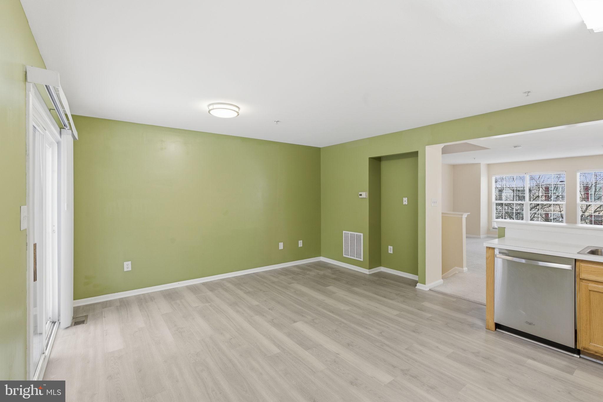 907 Vauxhall Road Landover, MD 20785 - Photo 29 of 37 wooden floor in an empty room with a window