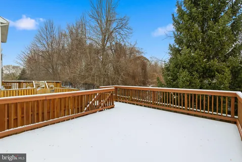 a view of balcony with wooden fence and floor