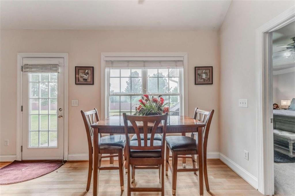 9 Royal Oak Drive Northeast Rome, GA 30165 - Photo 11 of 31 a dining room with furniture and wooden floor
