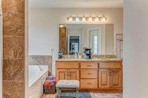 9 Royal Oak Drive Northeast Rome, GA 30165 - Photo 15 of 31 a bathroom with a granite countertop sink a mirror and a shower