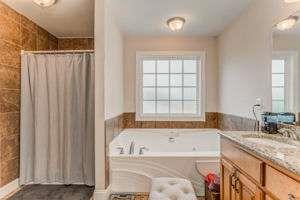 9 Royal Oak Drive Northeast Rome, GA 30165 - Photo 16 of 31 a bathroom with a granite countertop tub sink and mirror
