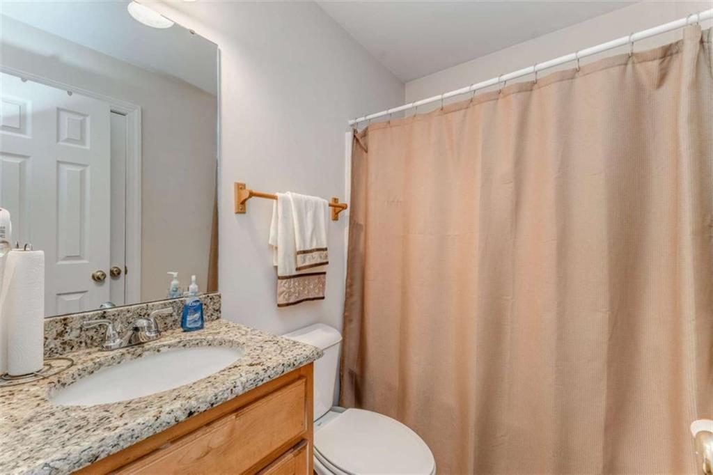 9 Royal Oak Drive Northeast Rome, GA 30165 - Photo 19 of 31 a bathroom with a granite countertop sink and a mirror