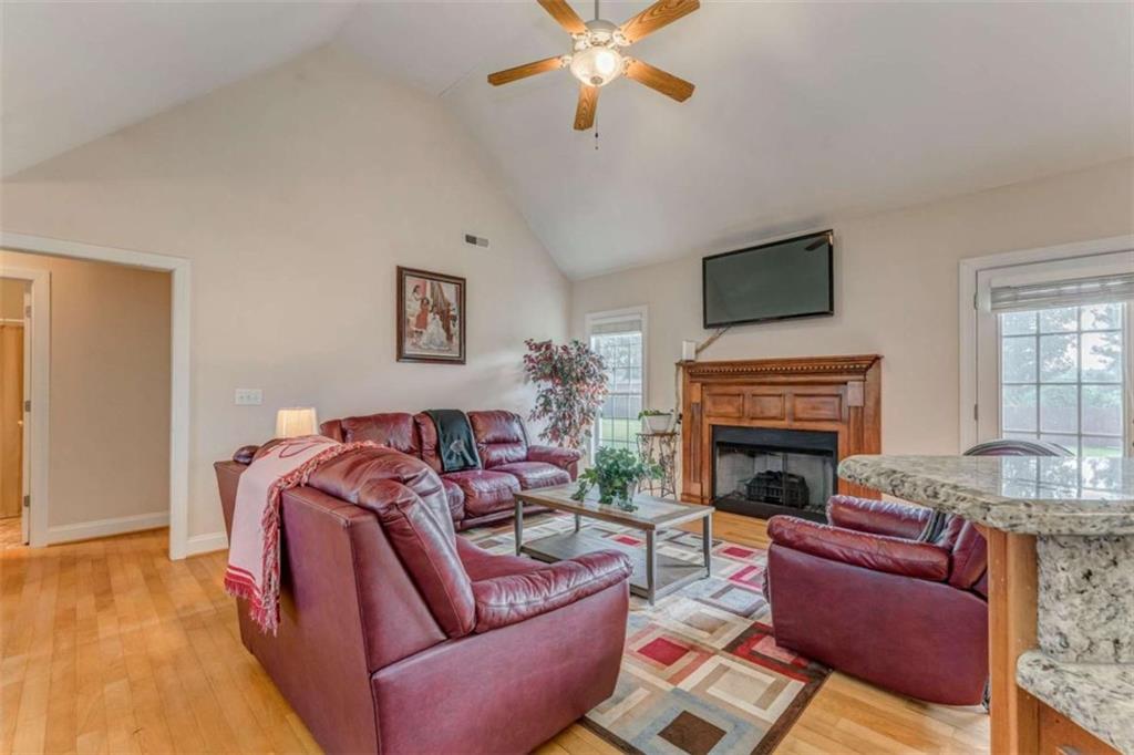 9 Royal Oak Drive Northeast Rome, GA 30165 - Photo 4 of 31 a living room with furniture a fireplace and a flat screen tv