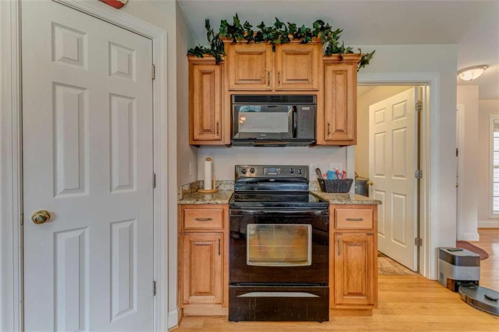 9 Royal Oak Drive Northeast Rome, GA 30165 - Photo 9 of 31 a kitchen with stainless steel appliances granite countertop a stove and a microwave