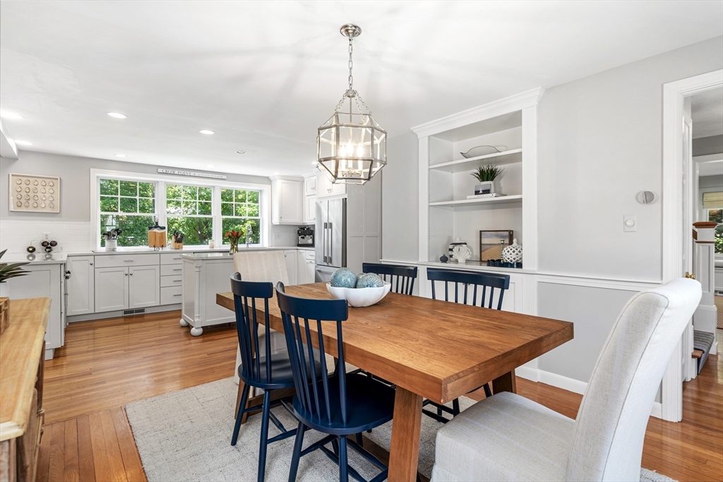 65 Bel Air Road Hingham, MA 02043 - Photo 11 of 35 a view of a dining room with furniture window and wooden floor