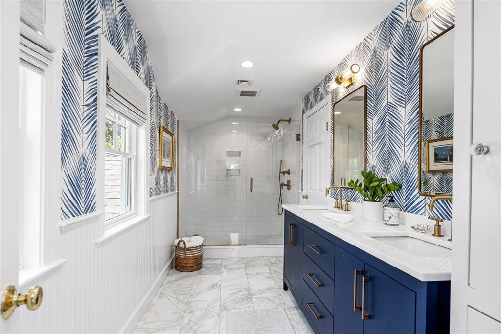 65 Bel Air Road Hingham, MA 02043 - Photo 20 of 35 a spacious bathroom with a double vanity sink and a mirror