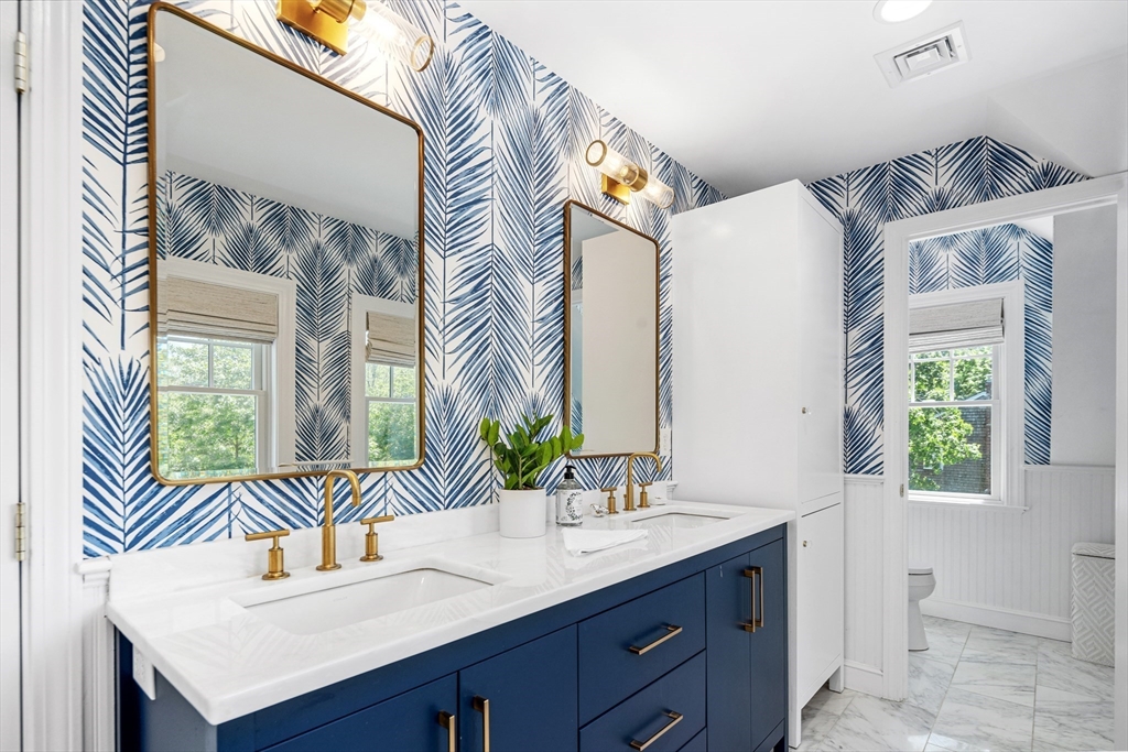 65 Bel Air Road Hingham, MA 02043 - Photo 21 of 35 a bathroom with a sink and a mirror