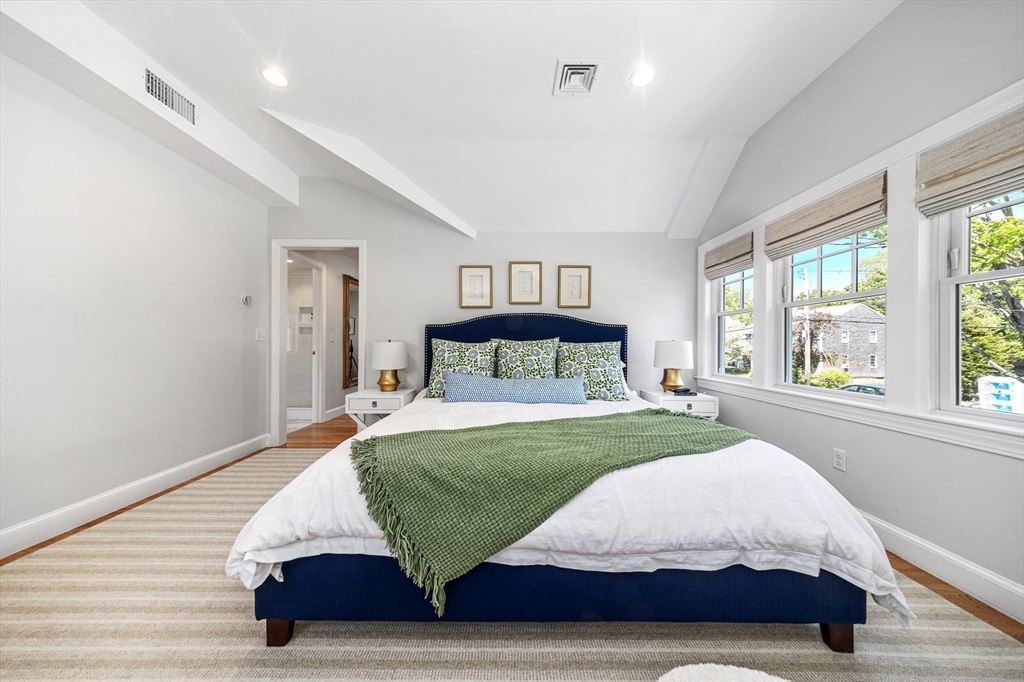 65 Bel Air Road Hingham, MA 02043 - Photo 22 of 35 a bedroom with a large bed and a large window