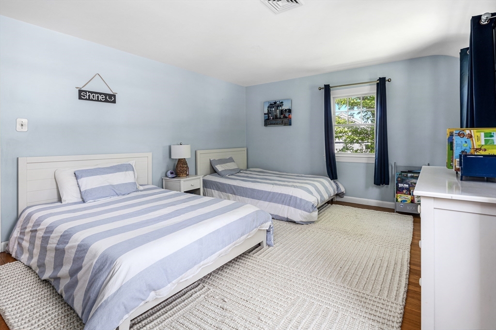 65 Bel Air Road Hingham, MA 02043 - Photo 23 of 35 a bedroom with two beds and a couch