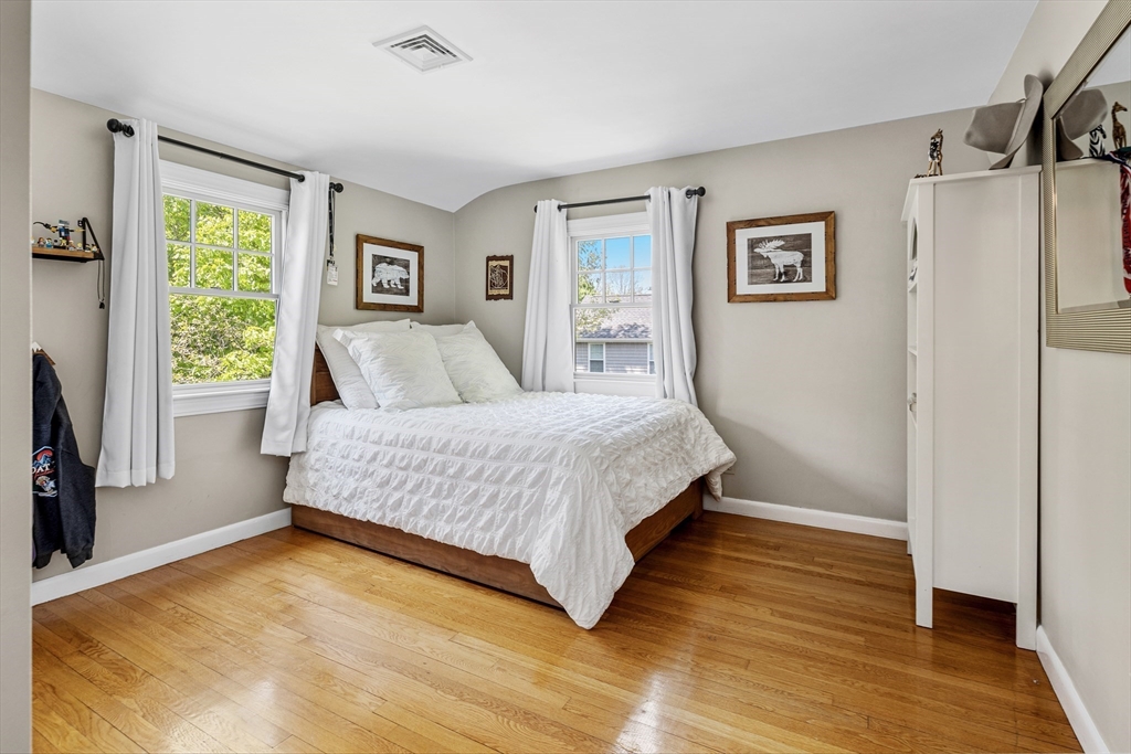 65 Bel Air Road Hingham, MA 02043 - Photo 26 of 35 a bedroom with a bed and a window