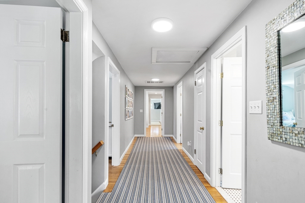 65 Bel Air Road Hingham, MA 02043 - Photo 28 of 35 a view of a hallway with wooden floor and staircase