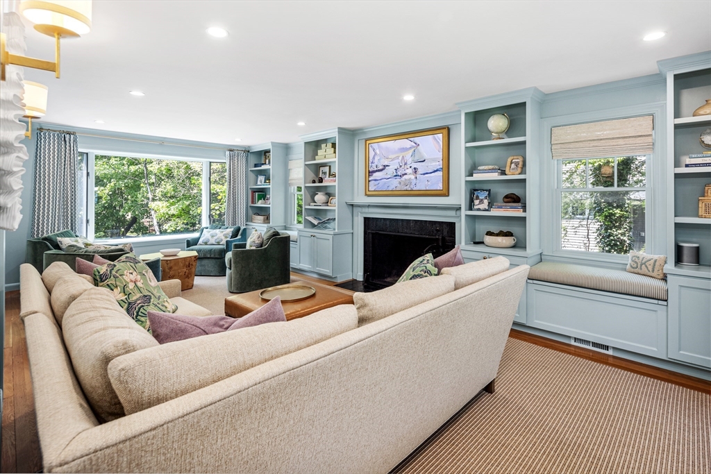 65 Bel Air Road Hingham, MA 02043 - Photo 6 of 35 a living room with furniture a large window and a fireplace