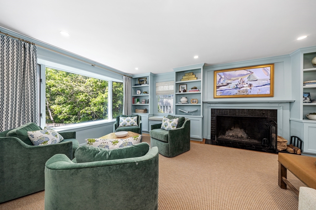 65 Bel Air Road Hingham, MA 02043 - Photo 7 of 35 a living room with furniture a fireplace and a large window