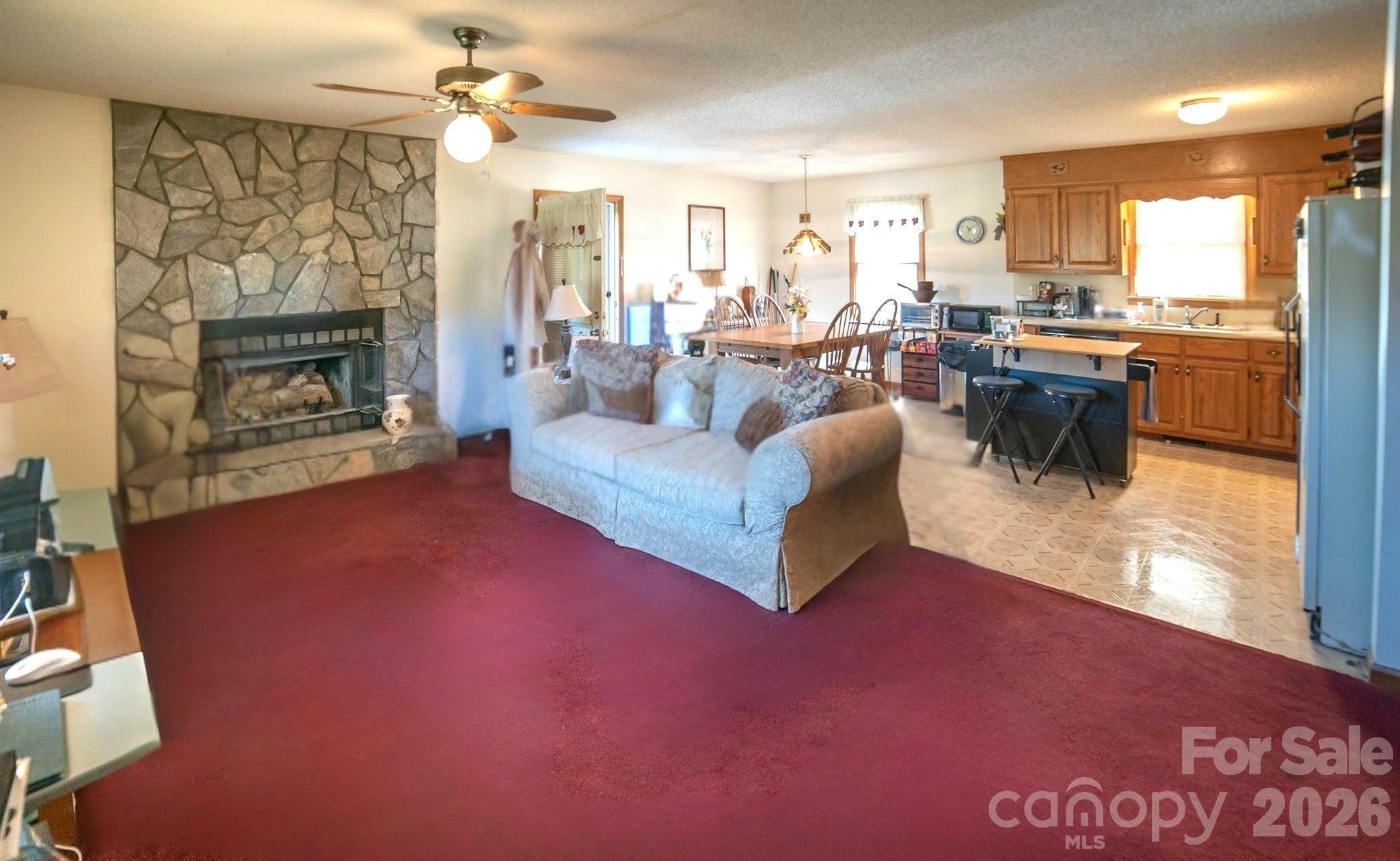 4186 Horseshoe Bend Road Hudson, NC 28638 - Photo 5 of 22 a living room with furniture and a fireplace