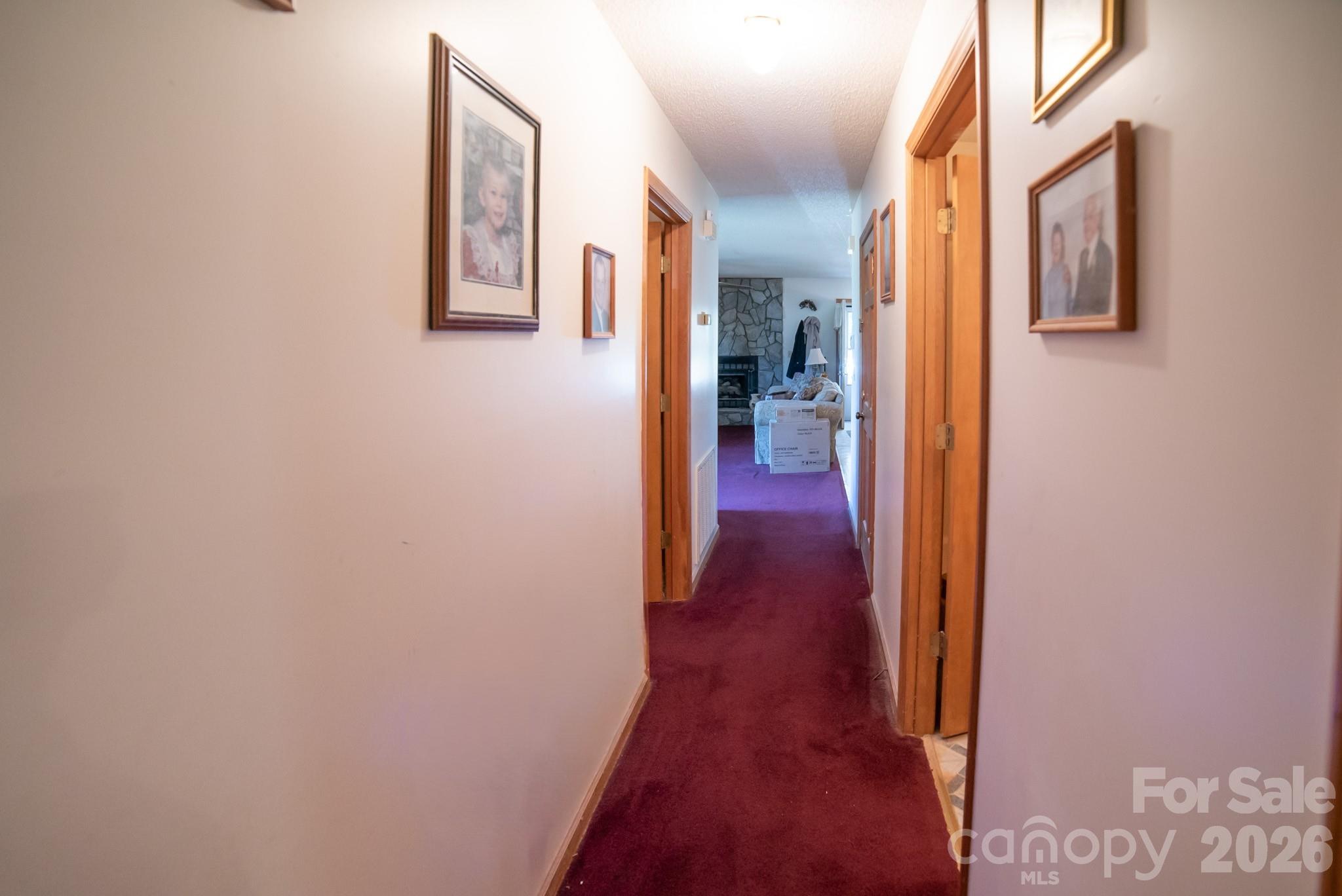 4186 Horseshoe Bend Road Hudson, NC 28638 - Photo 9 of 22 a view of a hallway with wooden floor
