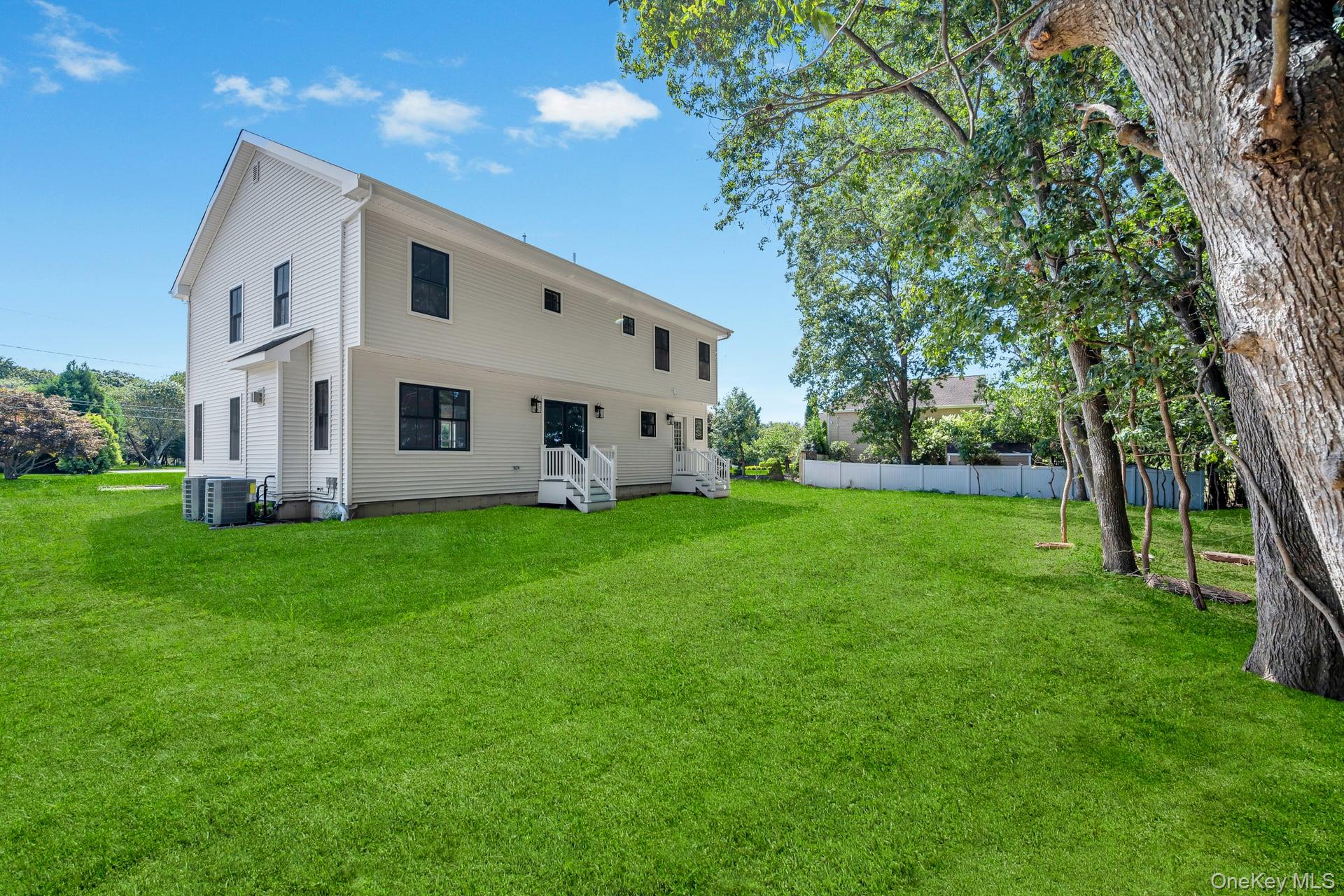 84 James Hawkins Road Moriches, NY 11955 - Photo 12 of 50 a front view of house with garden
